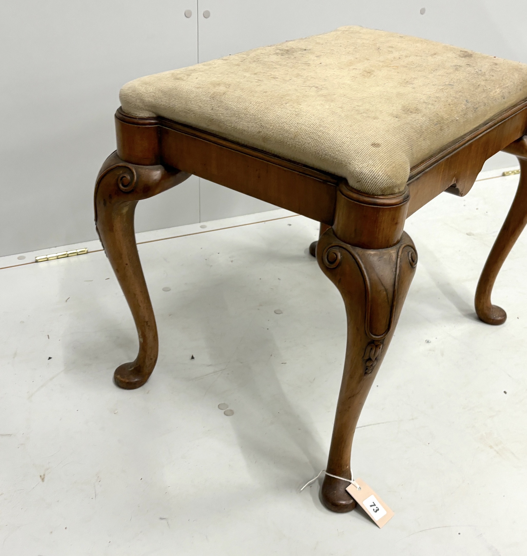 A Queen Anne Revival walnut dressing stool, width 64cm, depth 48cm, height 51cm